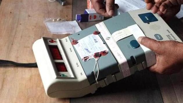 Election Commission officials seal an Electronic Voting Machine (EVM). (AFP File Photo) Election Commission officials seal an Electronic Voting Machine (EVM). (AFP File Photo)