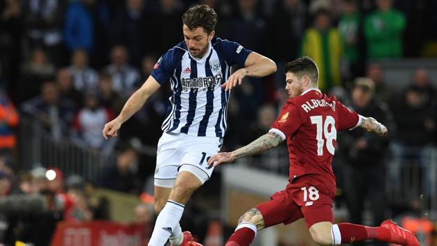 West Bromwich Albion's English striker Jay Rodriguez is tackled by Liverpool's Spanish defender Alberto Moreno during the English FA Cup fourth round football match at Anfield in Liverpool on Saturday. (AFP) West Bromwich Albion's English striker Jay Rodriguez is tackled by Liverpool's Spanish defender Alberto Moreno during the English FA Cup fourth round football match at Anfield in Liverpool on Saturday. (AFP)