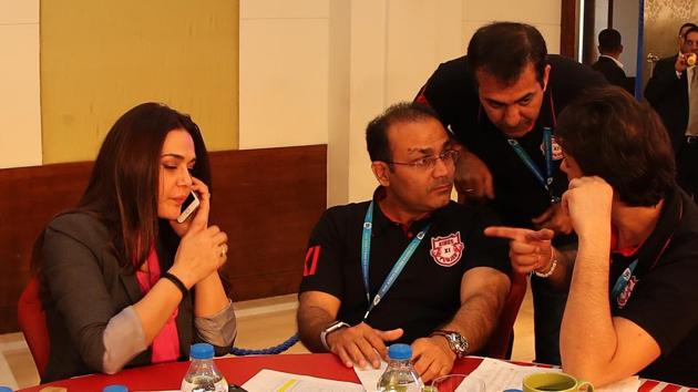 Preity Zinta and Kings XI Punjab (KXIP) mentor Virender Sehwag with Ness Wadia during day 2 of the Indian Premier League (IPL) 2018 auction at the ITC Gardenia hotel in Bangalore. The Preity Zinta co-owned franchise could play under a new name next season.(BCCI)