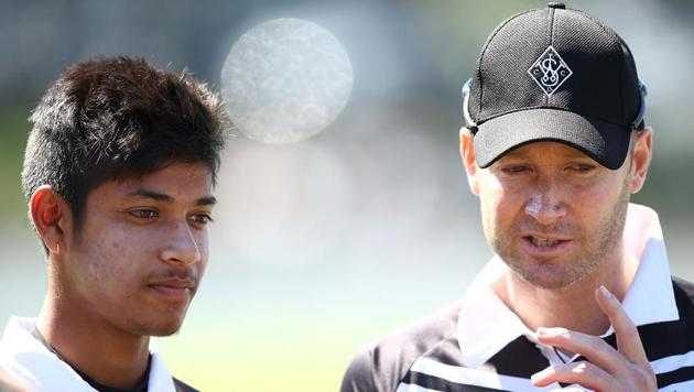 Michael Clarke and Nepal’s Sandeep Lamichhane (left) during a first grade match at Allan Border Oval on September 24, 2016 in Sydney. Lamichhane will turn out for Delhi Daredevils in IPL 2018.(Getty Images)