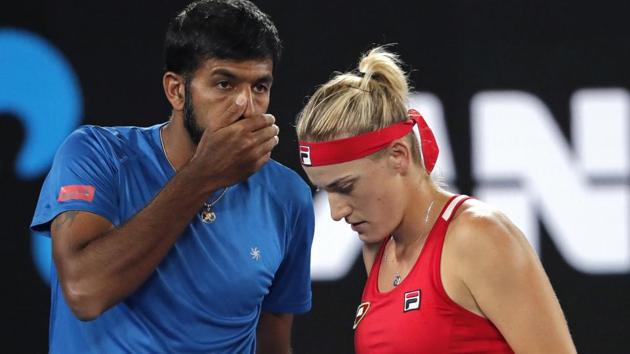 Hungary's Timea Babos (R) and partner Rohan Bopanna of India talk tactics against Canada's Gabriela Dabrowski and Croatia's Mate Pavic in the mixed doubles final of the Australian Open tennis championships in Melbourne on Sunday. (AP) Hungary's Timea Babos (R) and partner Rohan Bopanna of India talk tactics against Canada's Gabriela Dabrowski and Croatia's Mate Pavic in the mixed doubles final of the Australian Open tennis championships in Melbourne on Sunday. (AP)