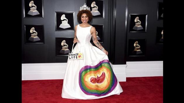 Joy Villa also clearly made a statement with a white wedding dress that she hand-painted with the image of a fetus surrounded by a rainbow paired with a purse that read “choose life.” (Evan Agostini / Invision / AP) Joy Villa also clearly made a statement with a white wedding dress that she hand-painted with the image of a fetus surrounded by a rainbow paired with a purse that read “choose life.” (Evan Agostini / Invision / AP)