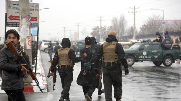Afghan security personnel detain a suspect, center, at the site of an attack on the Marshal Fahim military academy in Kabul, Afghanistan, Monday, Jan. 29, 2018. (AP) Afghan security personnel detain a suspect, center, at the site of an attack on the Marshal Fahim military academy in Kabul, Afghanistan, Monday, Jan. 29, 2018. (AP)