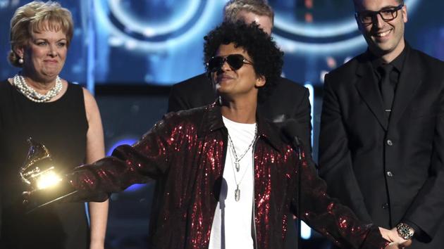 Bruno Mars accepts the award for record of the year for 24K Magic at the 60th annual Grammy Awards at Madison Square Garden on Sunday. He won album of the year award as well. (Matt Sayles/Invision/AP) Bruno Mars accepts the award for record of the year for 24K Magic at the 60th annual Grammy Awards at Madison Square Garden on Sunday. He won album of the year award as well. (Matt Sayles/Invision/AP)