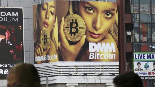 A huge advertisement of Bitcon is displayed near a train station in Tokyo Monday, Jan. 29, 2018. (AP) A huge advertisement of Bitcon is displayed near a train station in Tokyo Monday, Jan. 29, 2018. (AP)