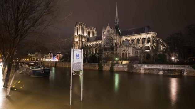 A picture taken on the night of January 28, 2018 in Paris shows the flooded banks of the Seine river near Notre-Dame Cathedral. (AFP) A picture taken on the night of January 28, 2018 in Paris shows the flooded banks of the Seine river near Notre-Dame Cathedral. (AFP)