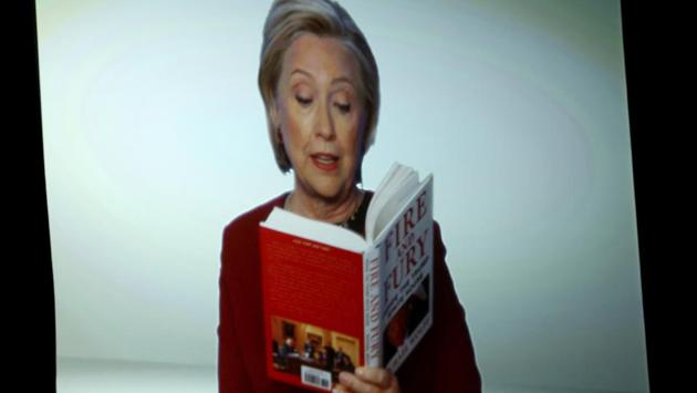 Hillary Clinton appears on screen reading an excerpt from the book "Fire and Fury" during a skit at the 60th annual Grammy Awards at Madison Square Garden on Sunday, Jan. 28, 2018, in New York. (Matt Sayles/Invision/AP) Hillary Clinton appears on screen reading an excerpt from the book "Fire and Fury" during a skit at the 60th annual Grammy Awards at Madison Square Garden on Sunday, Jan. 28, 2018, in New York. (Matt Sayles/Invision/AP)