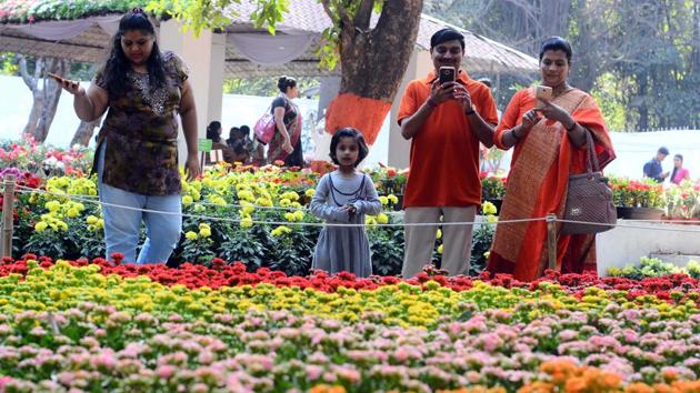 While her parents were busy clicking pictures of the floral decorations, this young girl was completely bamboozled by the beauty of the flowers and took a minute to absorb it in. (Shankar Narayan/HT PHOTO) While her parents were busy clicking pictures of the floral decorations, this young girl was completely bamboozled by the beauty of the flowers and took a minute to absorb it in. (Shankar Narayan/HT PHOTO)