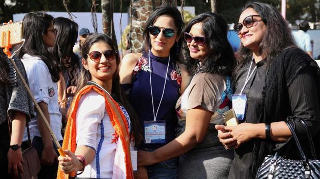 Visitors to the Jaipur Literature Festival busy clicking selfies during sessions.(PTI)