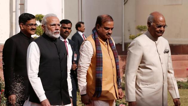 Prime Minister Narendra Modi and President Ram Nath Kovind alk inside the parliament premises as they arrive to attend the first day of the budget session in New Delhi.(Reuters Photo)
