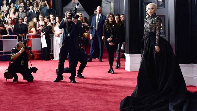 At Grammy 2018 red carpet, white roses stood for Time’s Up campaign as powerful men and women wore them with lace, sequins and feathers. (AFP) At Grammy 2018 red carpet, white roses stood for Time’s Up campaign as powerful men and women wore them with lace, sequins and feathers. (AFP)
