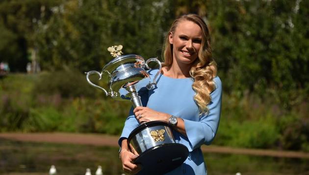 Denmark's Caroline Wozniacki holds up the winner's trophy at the Royal Botanical Gardens in Melbourne on January 28, 2018, a day after beating Romania's Simona Halep in their women's singles final match at the Australian Open tennis tournament. (AFP) Denmark's Caroline Wozniacki holds up the winner's trophy at the Royal Botanical Gardens in Melbourne on January 28, 2018, a day after beating Romania's Simona Halep in their women's singles final match at the Australian Open tennis tournament. (AFP)