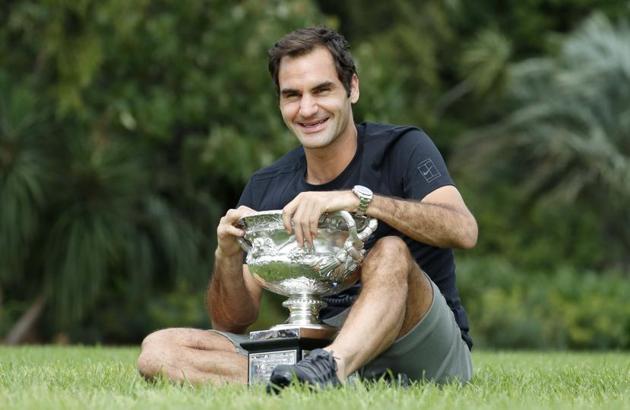 Roger Federer of Switzerland poses with the men's singles trophy during the winner's photoshoot at the government house in Melbourne on Monday. (REUTERS) Roger Federer of Switzerland poses with the men's singles trophy during the winner's photoshoot at the government house in Melbourne on Monday. (REUTERS)