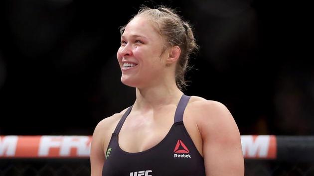 Ronda Rousey, a former UFC champion, has shifted completely to showbiz wrestling, joining the WWE after making a small appearance a the Royal Rumble Sunday night.(Getty Images)