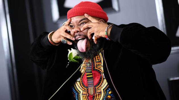 Musical artist Kokayi gestures as he arrives for the 60th Grammy Awards. (Jewel Samad / AFP) Musical artist Kokayi gestures as he arrives for the 60th Grammy Awards. (Jewel Samad / AFP)