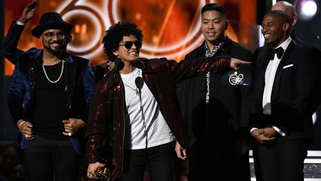 The feel-good Bruno Mars, who has revived retro funk and R&B for a new generation, swept the 60th Grammy Awards in a surprise snub for the hip-hop world, which had hoped for a major breakthrough on the music industry’s biggest night. Mars took home Album of the Year for “24K Magic” as well as Record of the Year, which recognizes the top tune, for the album’s title track. (Timothy A. Clary / AFP)