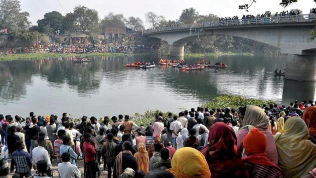 Rescue works underway on the second consecutive day on Tuesday after a public bus fell into the Bhairab river from a in Murshidabad district. (PTI) Rescue works underway on the second consecutive day on Tuesday after a public bus fell into the Bhairab river from a in Murshidabad district. (PTI)