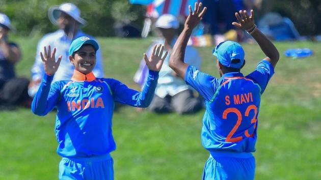 India's Shubman Gill (L) celebrates catching Pakistan's Hassan Khan with teammate Shivam Mavi during the ICC U19 World Cup semi-final between India and Pakistan at Hagley Oval in Christchurch on January 30, 2018.(AFP)