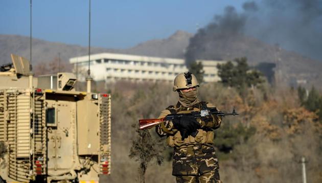 This file photo taken on January 21, 2018 shows Afghan security personnel standing guard as smoke billows from the Intercontinental Hotel during a fight between gunmen and Afghan security forces in Kabul. (AFP) This file photo taken on January 21, 2018 shows Afghan security personnel standing guard as smoke billows from the Intercontinental Hotel during a fight between gunmen and Afghan security forces in Kabul. (AFP)