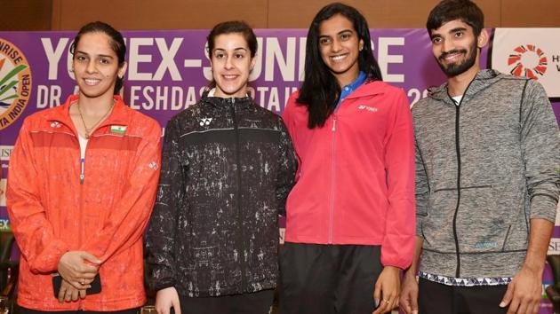 Saina Nehwal, PV Sindhu, Kidambi Srikanth and Spanish shuttler Carolina Marin pose for a photograph during a press conference of India Open badminton tournament in New Delhi on Tuesday.(PTI)