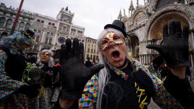Mayor Luigi Brugnaro has gone so far as to encourage visitors to head out the city’s suburbs to ease overcrowding, and promote celebrations on the mainland. (Filippo Monteforte / AFP) 