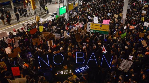 Protestors rally during a demonstration against the Muslim immigration ban at John F Kennedy International Airport on January 28, 2017 in New York City. The United States announced it was lifting its ban on refugees from 11 “high-risk” countries, but said those seeking to enter the US would come under much tougher scrutiny than in the past. (AFP Photo) Protestors rally during a demonstration against the Muslim immigration ban at John F Kennedy International Airport on January 28, 2017 in New York City. The United States announced it was lifting its ban on refugees from 11 “high-risk” countries, but said those seeking to enter the US would come under much tougher scrutiny than in the past. (AFP Photo)