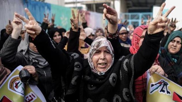 Palestinian women protest outside of the United Nations' offices in al-Nusirat refugee camp in the Gaza strip on January 17, 2018 after the White House froze tens of millions of dollars in contributions. (AFP) Palestinian women protest outside of the United Nations' offices in al-Nusirat refugee camp in the Gaza strip on January 17, 2018 after the White House froze tens of millions of dollars in contributions. (AFP)