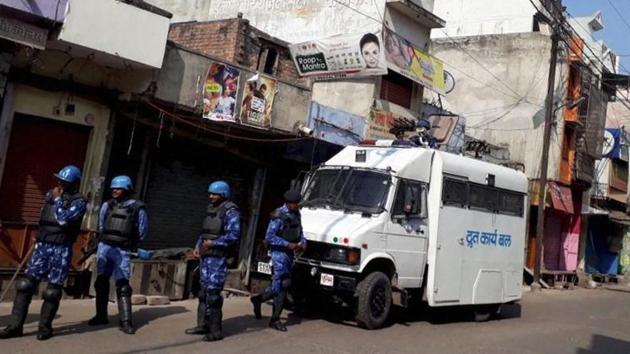 Rapid Action Force personnel in Kasganj on Sunday. (PTI Photo) Rapid Action Force personnel in Kasganj on Sunday. (PTI Photo)