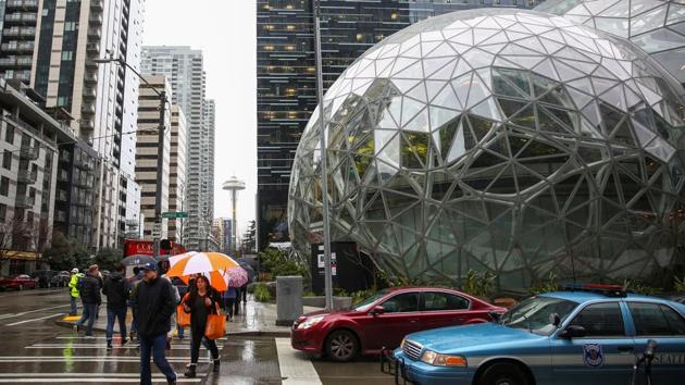 The Amazon Spheres are seen from Lenora Street, with the Space Needle in the background. Critics have called the Spheres a vanity project, illustrating Seattle’s sometimes strained relationship with its largest employer. (Lindsey Wasson / REUTERS) The Amazon Spheres are seen from Lenora Street, with the Space Needle in the background. Critics have called the Spheres a vanity project, illustrating Seattle’s sometimes strained relationship with its largest employer. (Lindsey Wasson / REUTERS)