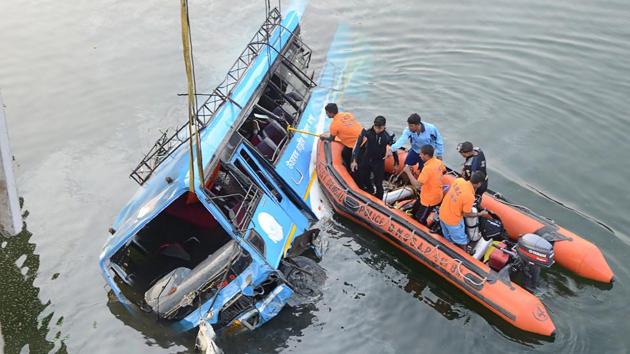 The bus which fell into Ghogra Canal in Murshidabad on Monday being pulled out. (AFP) The bus which fell into Ghogra Canal in Murshidabad on Monday being pulled out. (AFP)