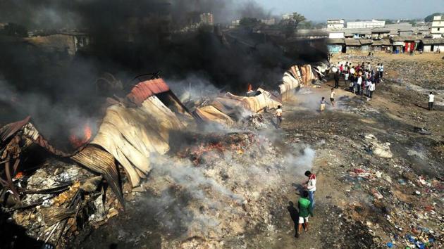 A major fire broke out in Bhiwandi, around 30km from Mumbai, early on Wednesday, gutting 15 scrap godowns and six shanties. (Praful Gangurde / HT Photo) A major fire broke out in Bhiwandi, around 30km from Mumbai, early on Wednesday, gutting 15 scrap godowns and six shanties. (Praful Gangurde / HT Photo)