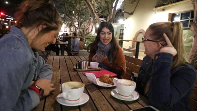Valenzuela (C), sits in a coffee shop with friends in Fullerton, California. “The reason this country labelled us as 'Dreamers' is because we want something — as if that dream is unattainable. No, If we can dream it, we can achieve it... It takes guts to have a dream and it takes guts to fight for it.” (Lucy Nicholson / REUTERS) Valenzuela (C), sits in a coffee shop with friends in Fullerton, California. “The reason this country labelled us as 'Dreamers' is because we want something — as if that dream is unattainable. No, If we can dream it, we can achieve it... It takes guts to have a dream and it takes guts to fight for it.” (Lucy Nicholson / REUTERS)