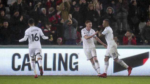 Swansea City boosted their chances of survival in the Premier League with a 3-1 win over Arsenal with Sam Clucas scoring twice and Jordan Ayew scoring one. (AP) Swansea City boosted their chances of survival in the Premier League with a 3-1 win over Arsenal with Sam Clucas scoring twice and Jordan Ayew scoring one. (AP)