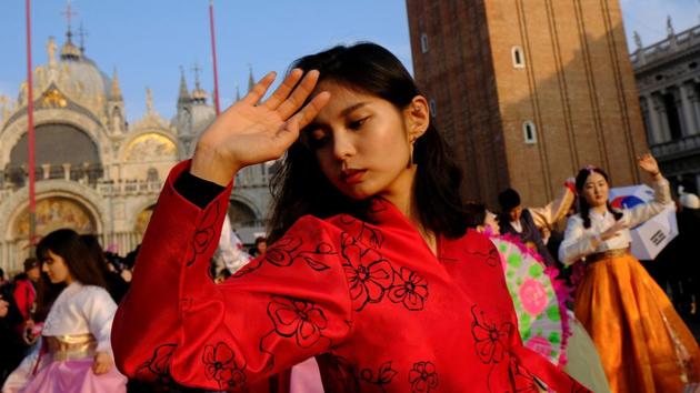 Dancers from South Korea perform during the Carnival in Saint Mark square. Each year, the Carnival brightens up winter days in January and February with its slew of parades, parties, and the magnificent costumes. (Manuel Silvestri / REUTERS) 