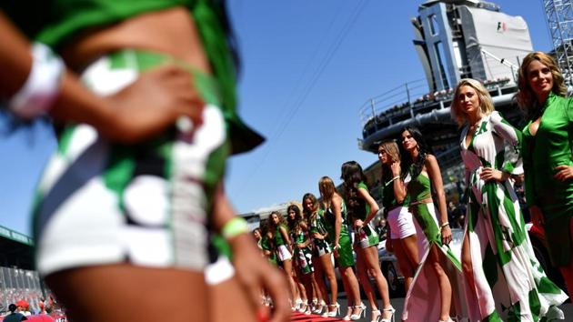 In this file photo taken on September 03, 2017, grid girls line up for the pit lane walk ahead of the Italian Formula One Grand Prix at the Autodromo Nazionale circuit in Monza. Formula One has ended the practice of using scantily clad walk-on "grid girls" before races, the sport's organisers Liberty Media said on Wednesday. (AFP) In this file photo taken on September 03, 2017, grid girls line up for the pit lane walk ahead of the Italian Formula One Grand Prix at the Autodromo Nazionale circuit in Monza. Formula One has ended the practice of using scantily clad walk-on "grid girls" before races, the sport's organisers Liberty Media said on Wednesday. (AFP)