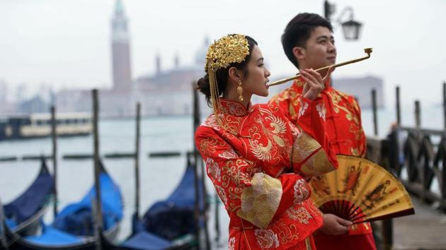 Today around 3 million visitors from around the world descend on the lagoon city to join in the celebrations, which continue until Shrove Tuesday just before the Lent fasting period. (Filippo Monteforte / AFP) 