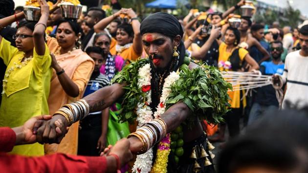 A devotee (C) is tied with ropes, hooked to his back as he dances in penance during Thaipusam celebrations in Kuala Lumpur. (Manan Vatsyayana / AFP) A devotee (C) is tied with ropes, hooked to his back as he dances in penance during Thaipusam celebrations in Kuala Lumpur. (Manan Vatsyayana / AFP)