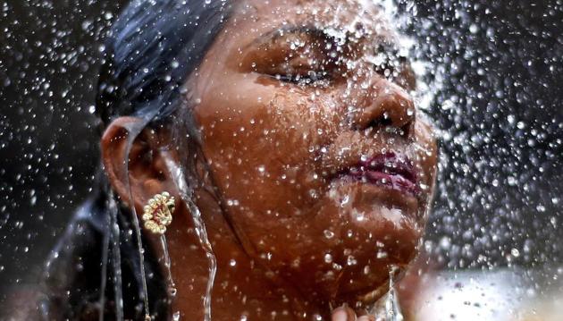 A devotee performs a ritual bath during the festival in Malaysia. Thousands thronged the Batu Caves on the outskirts of the capital in the early hours, walking barefoot up the 272 steps towards the site’s limestone hilltop shrine. (Sadiq Asyraf / AP) A devotee performs a ritual bath during the festival in Malaysia. Thousands thronged the Batu Caves on the outskirts of the capital in the early hours, walking barefoot up the 272 steps towards the site’s limestone hilltop shrine. (Sadiq Asyraf / AP)