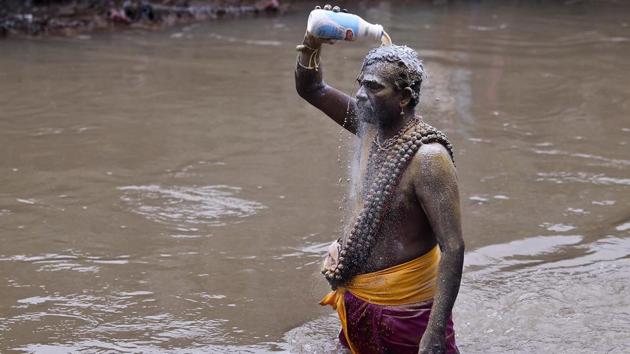 A devotee cleans himself with milk during the festival at Batu Caves. (Sadiq Asyraf / AP) A devotee cleans himself with milk during the festival at Batu Caves. (Sadiq Asyraf / AP)