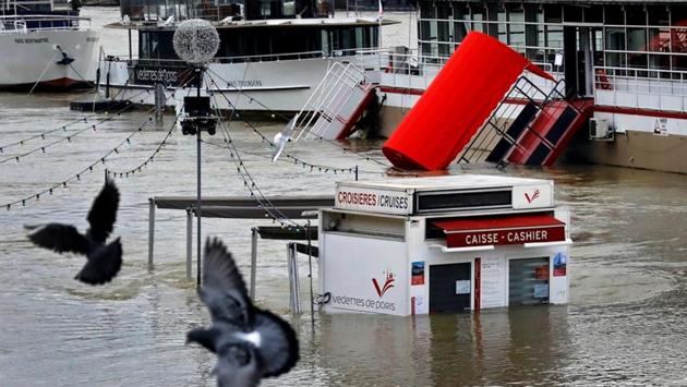A ticket booth for sightseeing boats is partly submerged by the River Seine. The water levels are expected to stay high for days or weeks spelling bad news for tourists hoping to cruise past Parisian sites on the famed “bateaux mouches” riverboats, or visit the bottom floor of the Louvre Museum, closed since last week as a precaution. (Mal Langsdon / REUTERS)