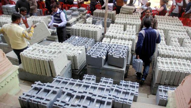Polling officers collect electronic voting machines(EVM) and polling materials before leaving for polling booths in Uttar Pradesh. (PTI File Photo) Polling officers collect electronic voting machines(EVM) and polling materials before leaving for polling booths in Uttar Pradesh. (PTI File Photo)