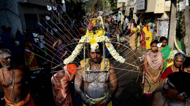 A Hindu devotee with his body pierced by metal skewers takes part in procession during the Thaipusam festival in Chennai. The festival is a purification ritual offering prayers and penance, observing a strict month long vegetarian diet and celebrating the birth of the Hindu deity Murugan. (Arun Sankar / AFP) A Hindu devotee with his body pierced by metal skewers takes part in procession during the Thaipusam festival in Chennai. The festival is a purification ritual offering prayers and penance, observing a strict month long vegetarian diet and celebrating the birth of the Hindu deity Murugan. (Arun Sankar / AFP)