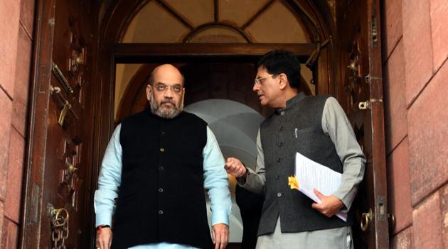 Minister of Railways of India, Piyush Goyal interacts with BJP National President Amit Shah during the first day of 2018 Parliament budget Session, in New Delhi.(Sonu Mehta/HT PHOTO)