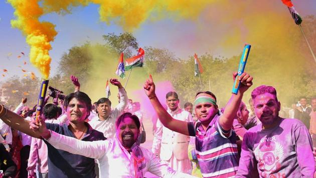 Congress workers celebrate the party’s success during Rajasthan bypolls after a victory in the Mandalgarh assembly seat by nearly 13,000 votes with counting for Alwar and Ajmer Lok Sabha seats underway. (PTI) Congress workers celebrate the party’s success during Rajasthan bypolls after a victory in the Mandalgarh assembly seat by nearly 13,000 votes with counting for Alwar and Ajmer Lok Sabha seats underway. (PTI)