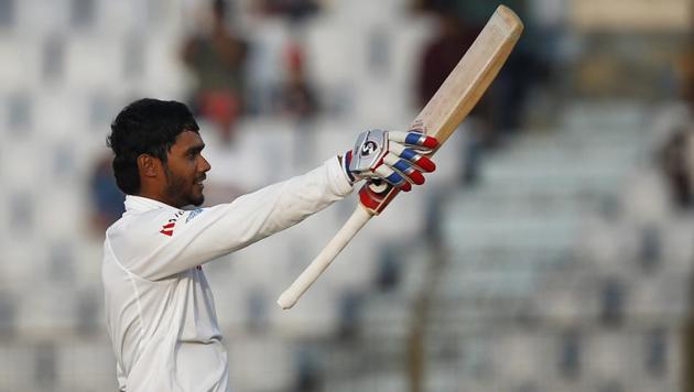 Sri Lanka's Dhananjaya de Silva acknowledges the crowed after scoring hundred runs during the second day of the first Test match against Bangladesh in Chittagong on Thursday. Get full cricket score and highlights of BAN vs SL here.(AP)