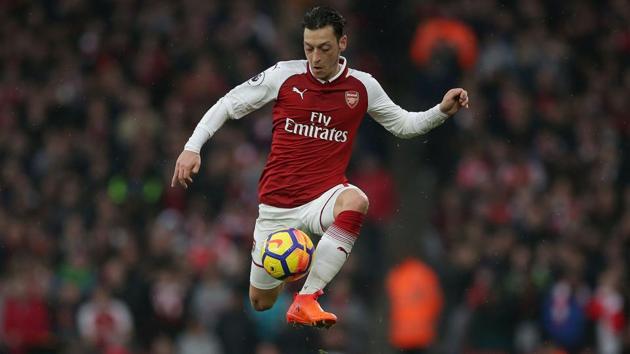 Arsenal's German midfielder Mesut Ozil ended speculation over his future at Arsenal by agreeing a new three-year deal with the Premier League giants on Thursday.(AFP)