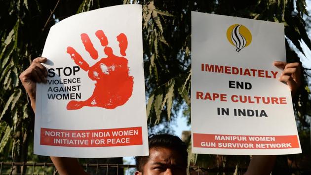 A social activist holds placards during a protest against rapes at Hauz Khas village in New Delhi. (AFP File) A social activist holds placards during a protest against rapes at Hauz Khas village in New Delhi. (AFP File)