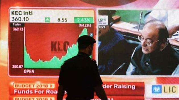 A man walks past a digital screen showing finance minister Arun Jaitley delivering the budget speech at Parliament, at the Bombay Stock Exchange in Mumbai on February 1, 2018. (AFP Photo) A man walks past a digital screen showing finance minister Arun Jaitley delivering the budget speech at Parliament, at the Bombay Stock Exchange in Mumbai on February 1, 2018. (AFP Photo)