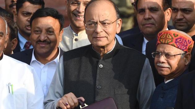Finance Minister Arun Jaitley (C) leaves his office to table the budget in parliament in New Delhi on February 1, 2018.(AFP)