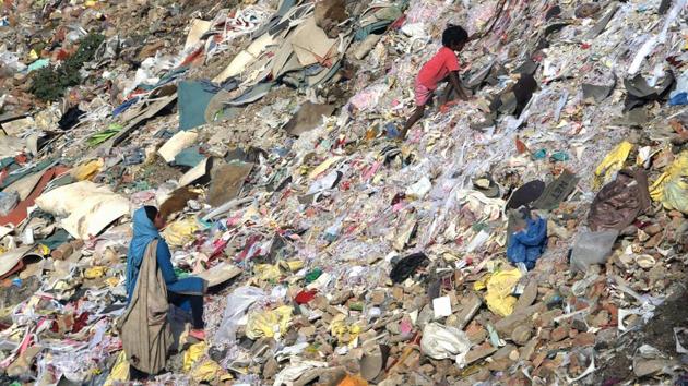 Rag pickers look for recyclable materials in a garbage heap on the outskirts of New Delhi. Removal of crop residue is to be subsidised in order to tackle the problem of pollution due to burning of crop residue. A Special scheme will also be implemented to address air pollution in Delhi-NCR region. (Dominique Faget / AFP) Rag pickers look for recyclable materials in a garbage heap on the outskirts of New Delhi. Removal of crop residue is to be subsidised in order to tackle the problem of pollution due to burning of crop residue. A Special scheme will also be implemented to address air pollution in Delhi-NCR region. (Dominique Faget / AFP)